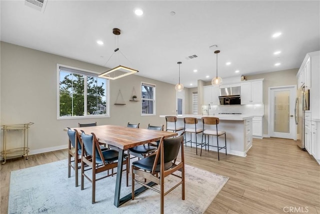 26 Wagon Wheel St, Phillips Ranch, CA 91766 - dining area with light wood finished floors, baseboards, and recessed lighting