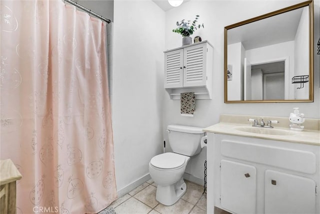 bathroom with toilet, a shower with curtain, vanity, tile patterned floors, and baseboards