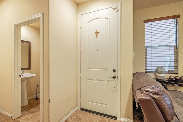 12229 Inspire Ln, Pacoima, CA 91331 - entryway featuring light tile patterned floors and baseboards