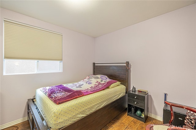 12229 Inspire Ln, Pacoima, CA 91331 - bedroom with baseboards and wood finished floors