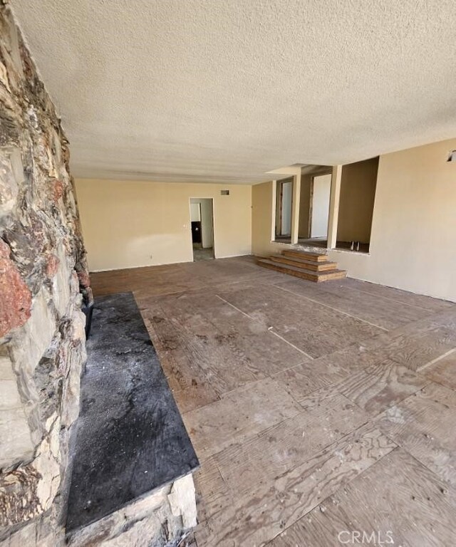 interior space featuring a textured ceiling