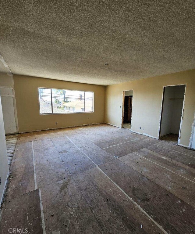 empty room with a textured ceiling