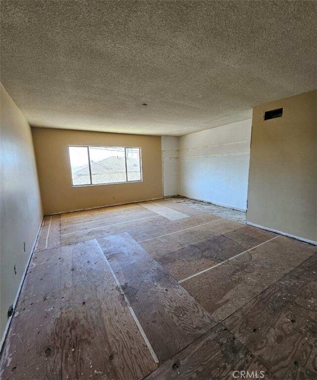 empty room featuring a textured ceiling