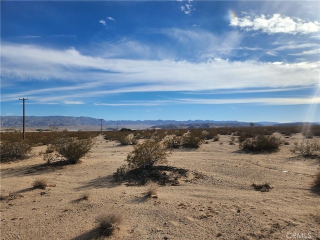 property view of mountains featuring a rural view and view of desert