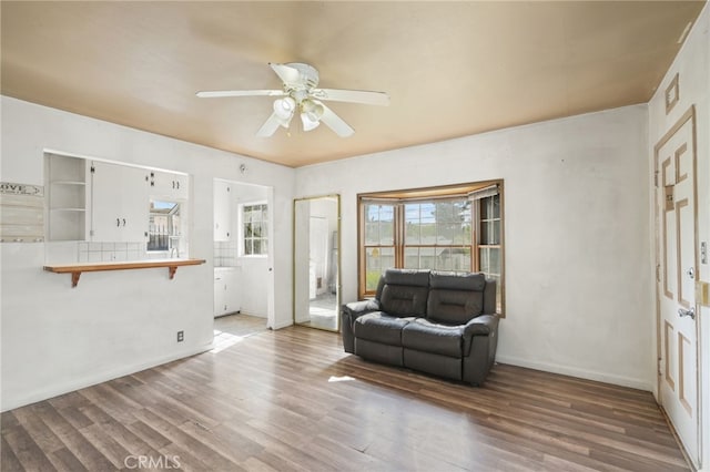 10546 Mcvine Ave, Sunland, CA 91040 - living room with a ceiling fan, wood finished floors, and baseboards