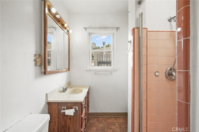 10546 Mcvine Ave, Sunland, CA 91040 - bathroom featuring toilet, a tile shower, tile patterned flooring, and vanity