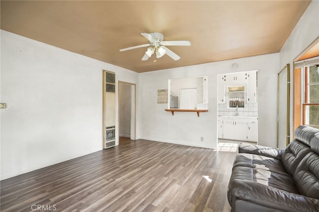 10546 Mcvine Ave, Sunland, CA 91040 - living room with ceiling fan, a heating unit, and wood finished floors