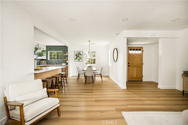6655 Balcom Ave, Reseda, CA 91335 - living room with baseboards, recessed lighting, and light wood-type flooring