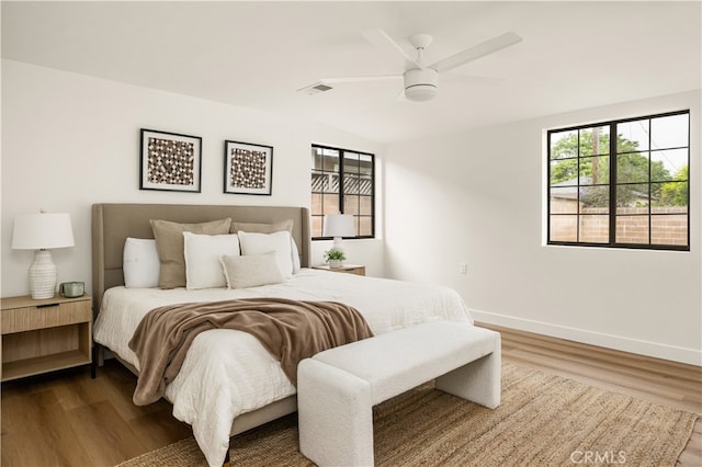 6655 Balcom Ave, Reseda, CA 91335 - bedroom with baseboards, dark wood-style flooring, visible vents, and a ceiling fan