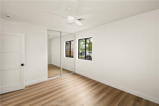 6655 Balcom Ave, Reseda, CA 91335 - unfurnished bedroom featuring light wood finished floors, a closet, visible vents, baseboards, and ceiling fan