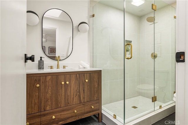 6655 Balcom Ave, Reseda, CA 91335 - full bathroom featuring tile patterned floors, vanity, toilet, and a stall shower