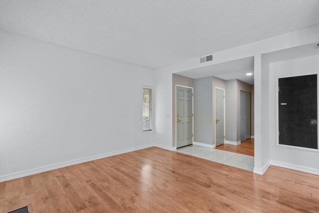 992 Lupine Hills Dr Unit 98, Vista, CA 92081 - unfurnished room featuring light wood finished floors and baseboards