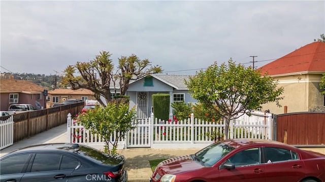 4253 Eugene St, Los Angeles, CA 90063 - view of front facade with a fenced front yard and stucco siding