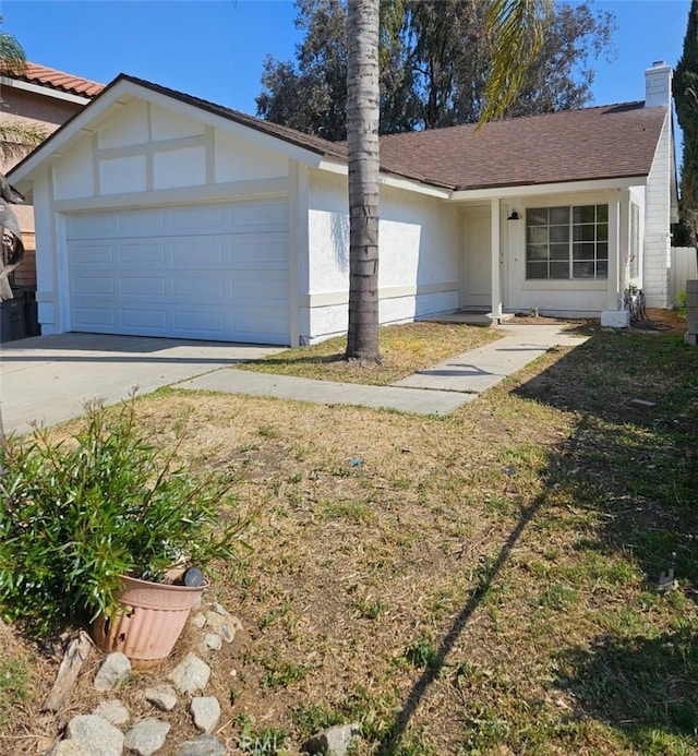 single story home featuring stucco siding, driveway, a chimney, and a garage