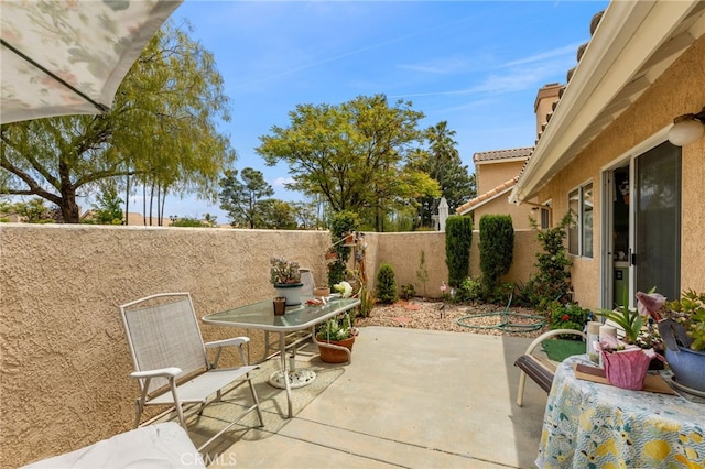 672 La Quinta Dr, Banning, CA 92220 - view of patio featuring a fenced backyard