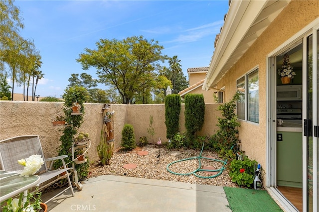 672 La Quinta Dr, Banning, CA 92220 - view of patio / terrace with a fenced backyard