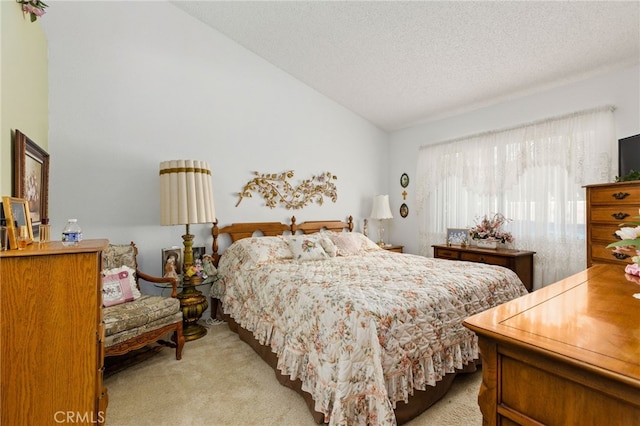 672 La Quinta Dr, Banning, CA 92220 - bedroom featuring light colored carpet, a textured ceiling, and vaulted ceiling