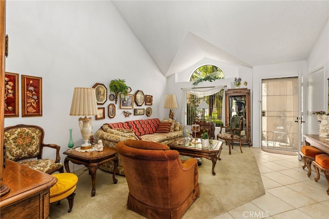 672 La Quinta Dr, Banning, CA 92220 - living room featuring light tile patterned floors and high vaulted ceiling