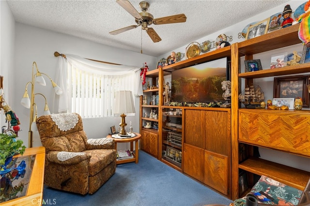 672 La Quinta Dr, Banning, CA 92220 - sitting room with a textured ceiling, ceiling fan, and carpet floors