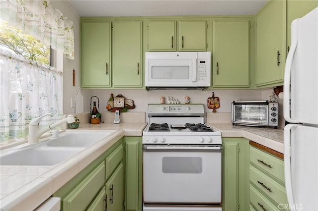 672 La Quinta Dr, Banning, CA 92220 - kitchen with white appliances, tile countertops, a toaster, and a sink