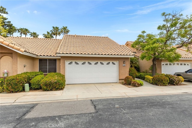 672 La Quinta Dr, Banning, CA 92220 - view of front of home featuring an attached garage, stucco siding, driveway, and a tile roof