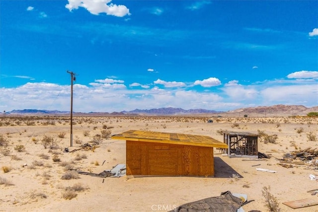 exterior space with a rural view and a desert view