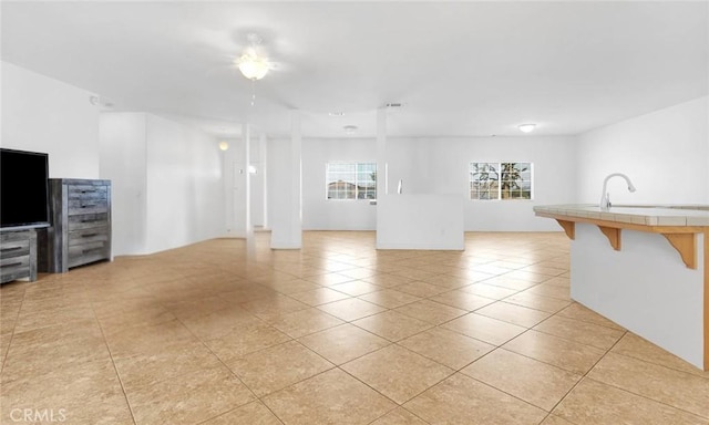 21683 Ramona Rd, Apple Valley, CA 92307 - unfurnished living room with a sink and light tile patterned floors