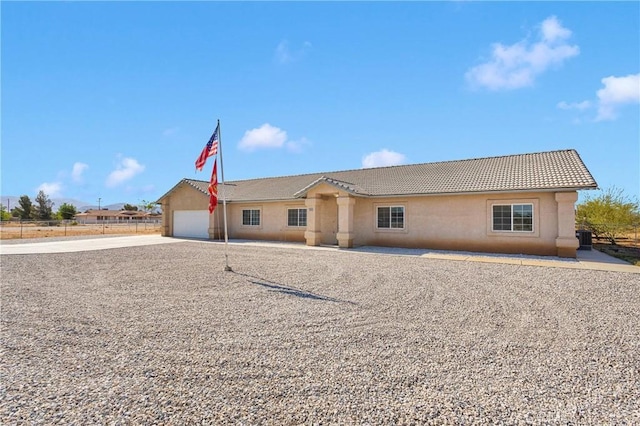 21683 Ramona Rd, Apple Valley, CA 92307 - ranch-style house with driveway, stucco siding, a tile roof, and a garage