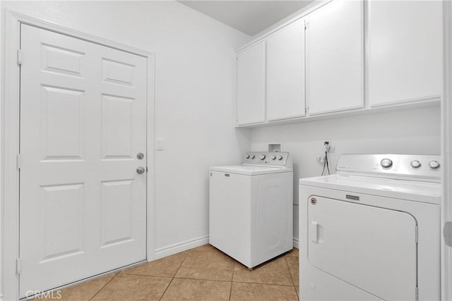 21683 Ramona Rd, Apple Valley, CA 92307 - laundry room with light tile patterned floors, baseboards, independent washer and dryer, and cabinet space