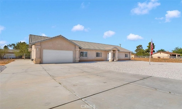 21683 Ramona Rd, Apple Valley, CA 92307 - single story home featuring fence, a garage, stucco siding, and concrete driveway