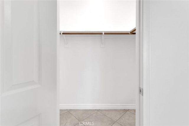 21683 Ramona Rd, Apple Valley, CA 92307 - walk in closet with light tile patterned floors
