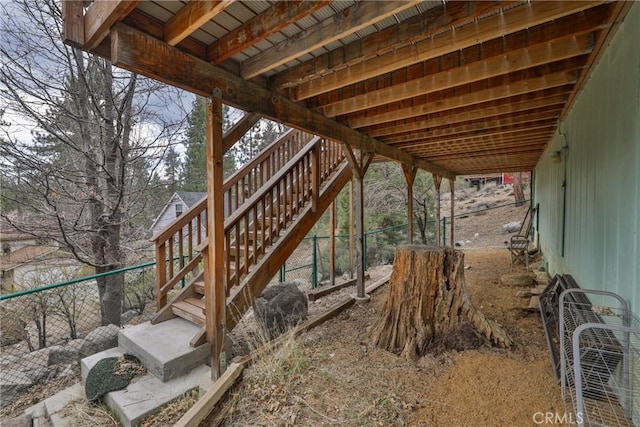 view of patio / terrace with fence and stairs