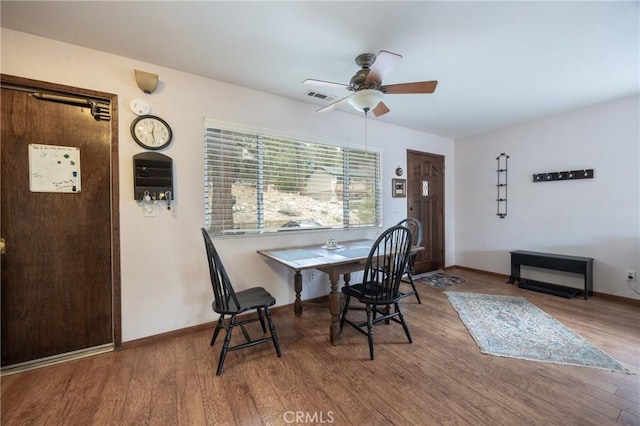 39177 Arapahoe Rd, Fawnskin, CA 92333 - dining area with baseboards, a ceiling fan, visible vents, and wood finished floors