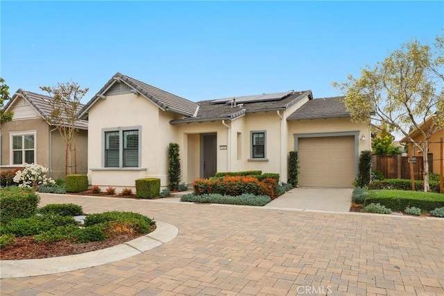 149 Luneta Ln, Rancho Mission Viejo, CA 92694 - single story home with fence, decorative driveway, solar panels, a garage, and stucco siding