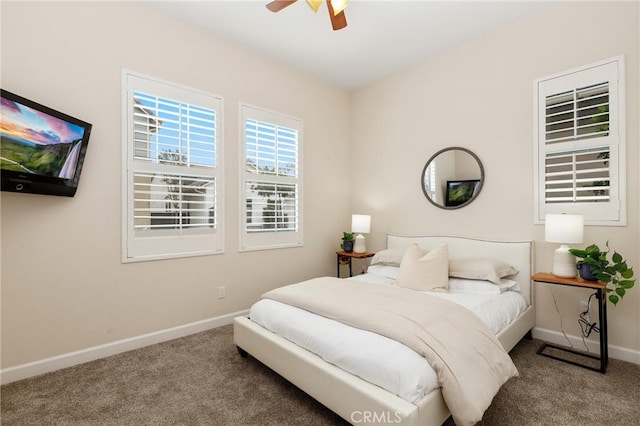 bedroom with carpet floors, baseboards, and a ceiling fan