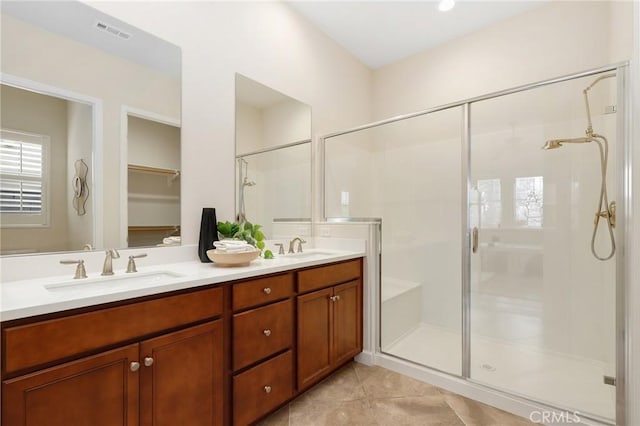 149 Luneta Ln, Rancho Mission Viejo, CA 92694 - bathroom featuring a sink, visible vents, tile patterned floors, a stall shower, and double vanity