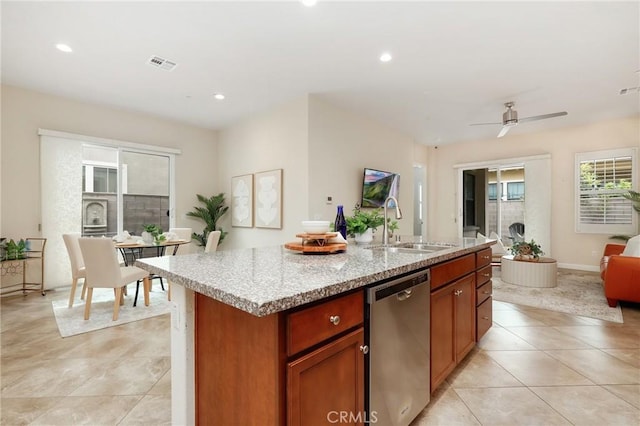 149 Luneta Ln, Rancho Mission Viejo, CA 92694 - kitchen with dishwasher, a sink, an island with sink, light stone countertops, and light tile patterned floors