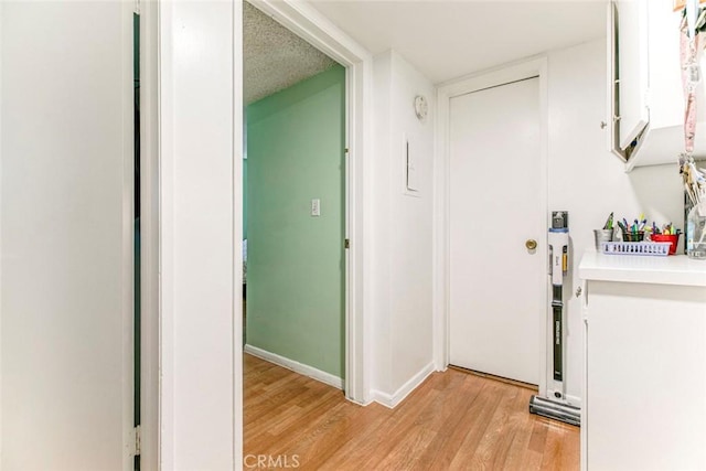 17151 Roscoe Blvd Unit 21, Northridge, CA 91325 - hallway with light wood-type flooring and baseboards