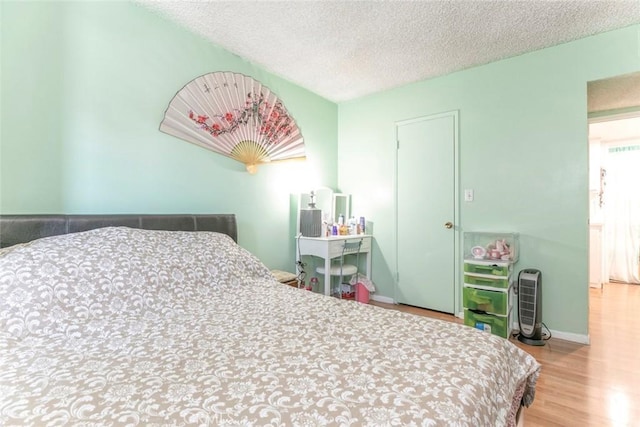 17151 Roscoe Blvd Unit 21, Northridge, CA 91325 - bedroom with wood finished floors and a textured ceiling