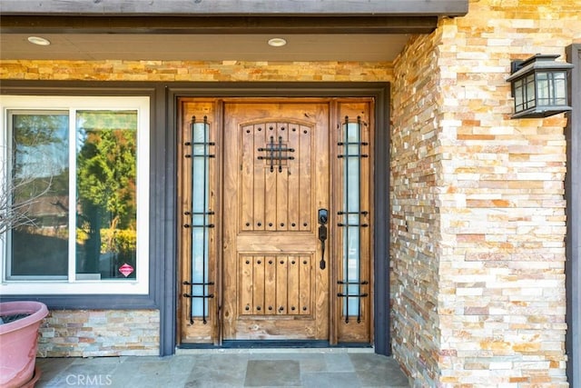 property entrance with brick siding