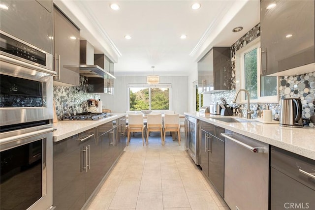 kitchen with beverage cooler, a sink, crown molding, tasteful backsplash, and appliances with stainless steel finishes