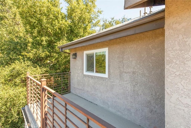 view of side of property with stucco siding