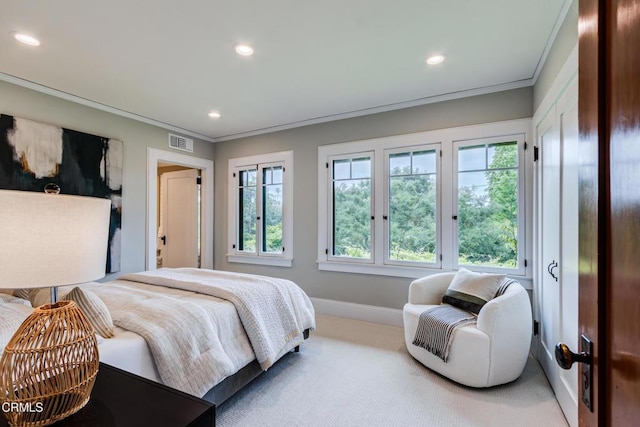 carpeted bedroom featuring visible vents, baseboards, ornamental molding, and recessed lighting