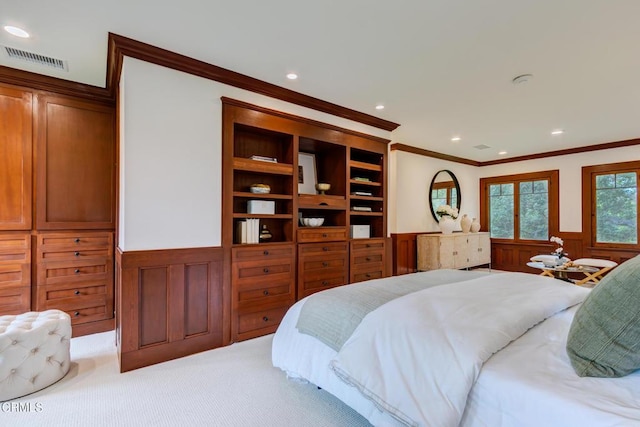 bedroom featuring light colored carpet, ornamental molding, visible vents, recessed lighting, and wainscoting
