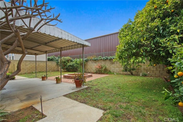 view of yard featuring a patio and a fenced backyard
