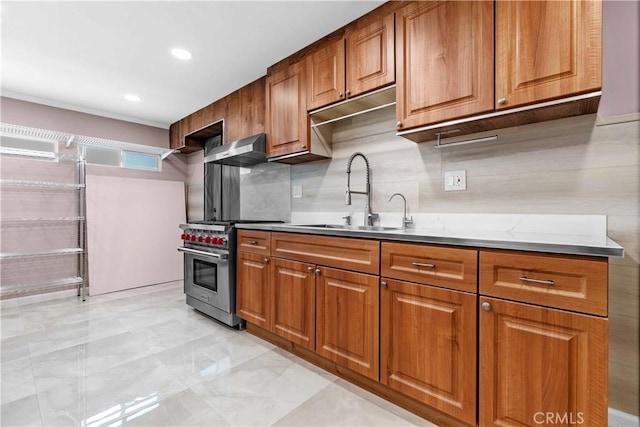 3348 Burritt Way, La Crescenta, CA 91214 - kitchen featuring high end stainless steel range, tasteful backsplash, brown cabinets, and a sink