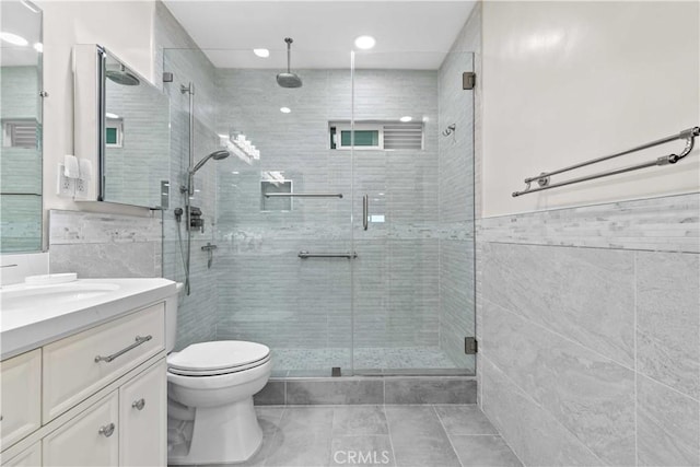 3348 Burritt Way, La Crescenta, CA 91214 - full bath featuring tile walls, toilet, a shower stall, tile patterned floors, and vanity