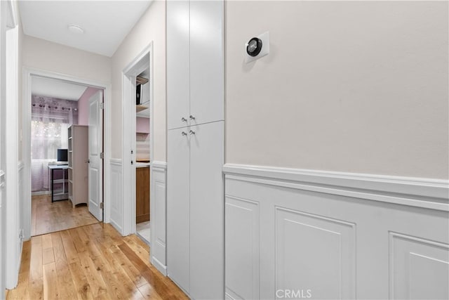 3348 Burritt Way, La Crescenta, CA 91214 - hall featuring a decorative wall, light wood-style flooring, and wainscoting
