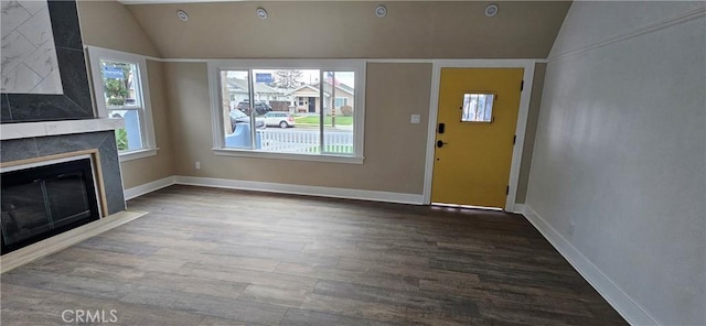 208 S Burris Ave, Compton, CA 90221 - unfurnished living room with lofted ceiling, wood finished floors, a fireplace, and baseboards
