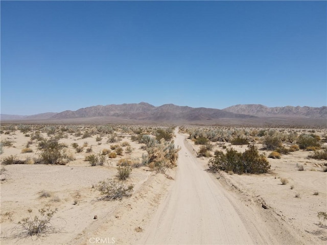 property view of mountains featuring a rural view and view of desert